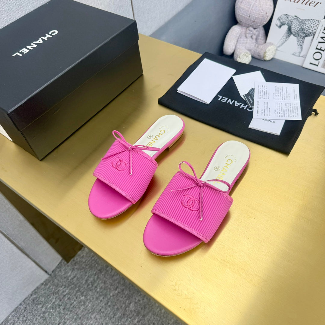 CHANEL BOW SLIPPERS IN BRIGHT PINK LAMBSKIN